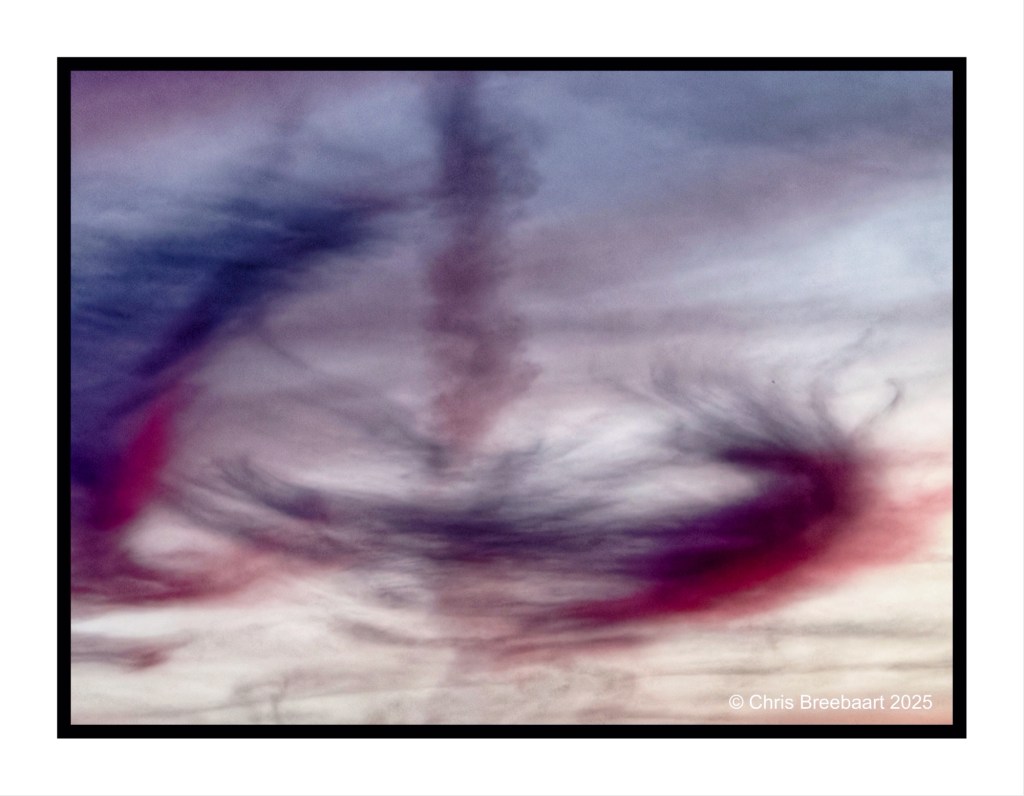 Colorful swirling clouds against an autumn sunset sky.