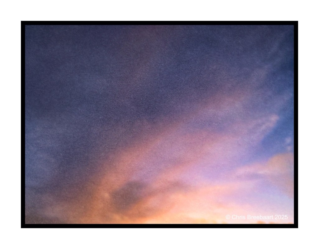 A serene winter sky at dusk with soft pastel colors blending into deep shades.