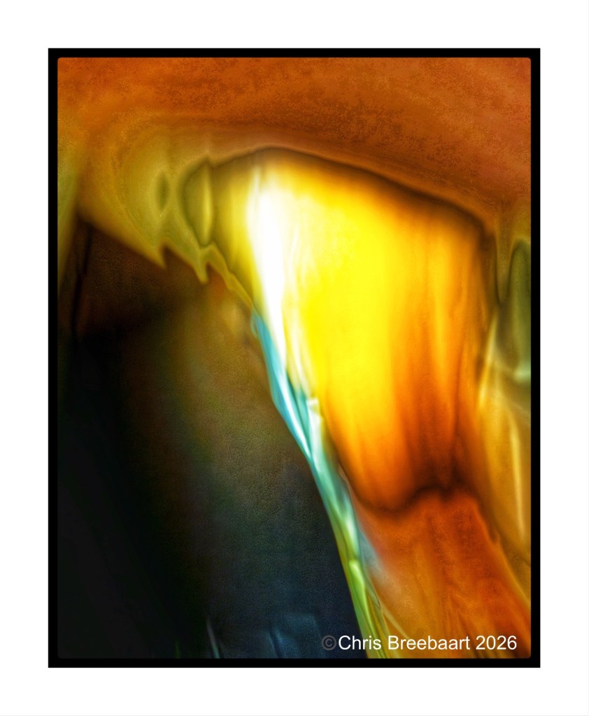 An abstract image featuring swirling colors of orange, yellow, and blue, resembling a creative blur or light effect, framed in black.