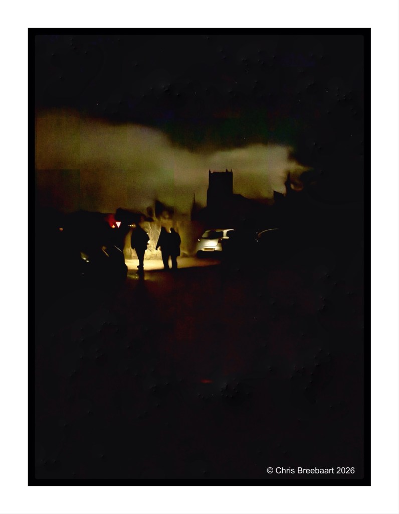 Two silhouetted figures walking on a dark street illuminated by a car's headlights, with a dark sky and a building in the background.